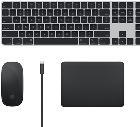 Top view of Mac accessories: Magic Keyboard, Magic Mouse, Magic Trackpad, and Thunderbolt cable.