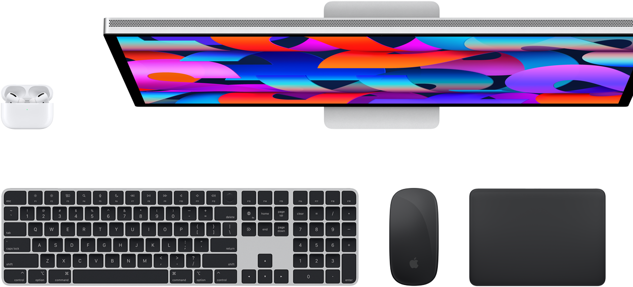 Top view of AirPods, Studio Display, Magic Keyboard, Magic Mouse and Magic Trackpad.