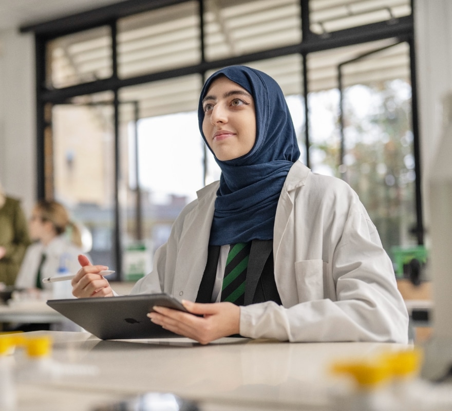 Student working on iPad with an Apple Pencil