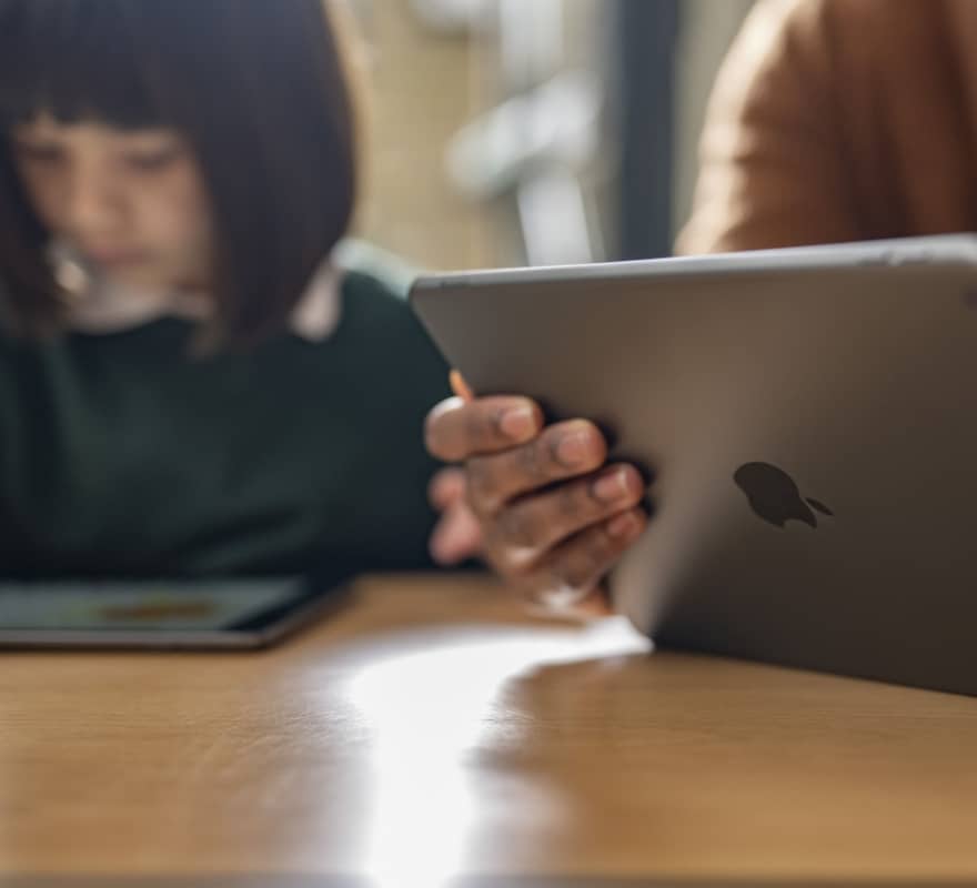 Student and teacher using iPad in class